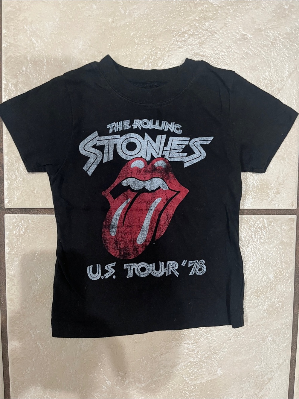 the Rolling Stones Black Kids Short-Sleeve Tee with Red Tongue Graphic